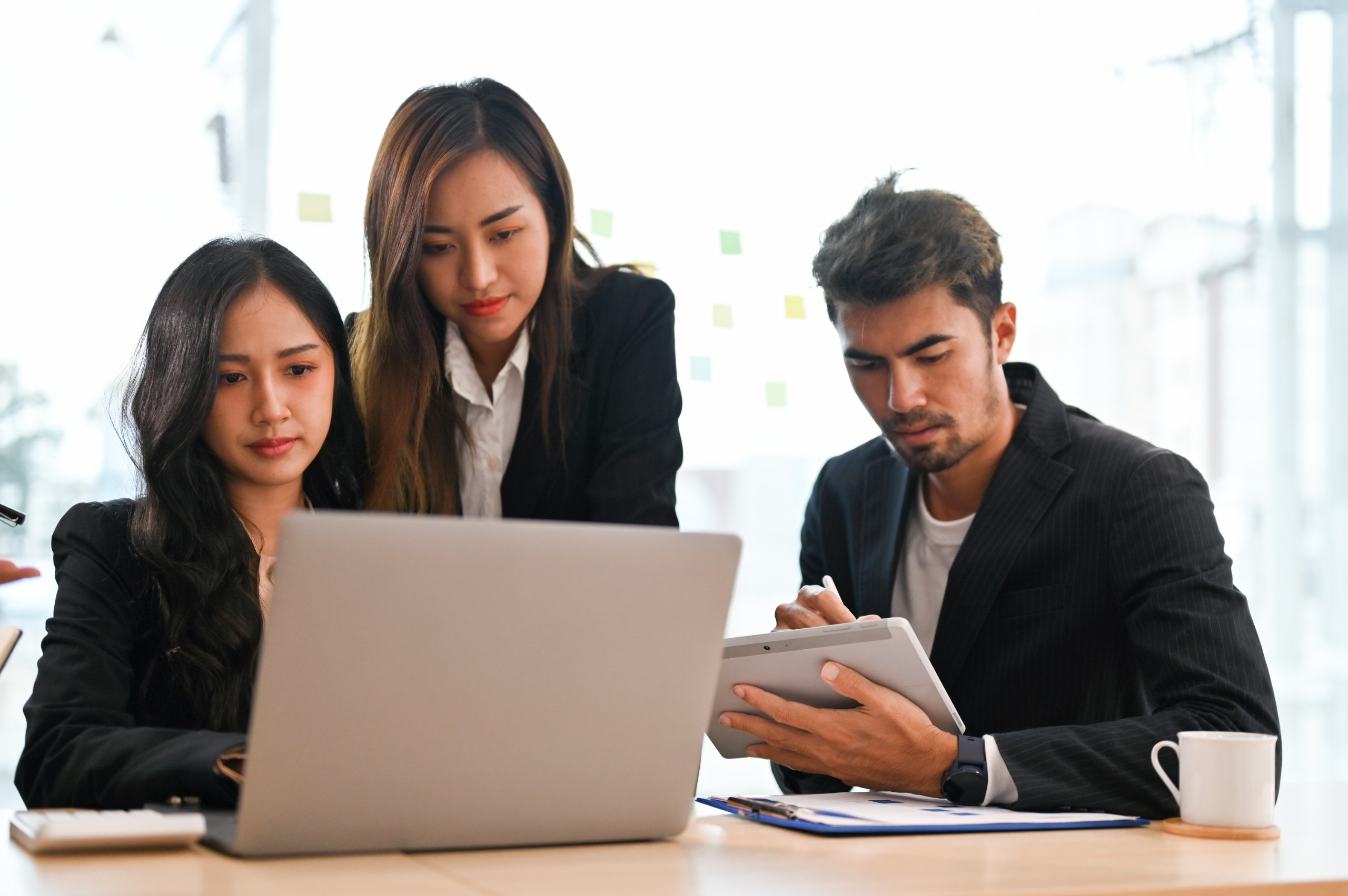 antibribe group-professional-asian-businesspeople-having-informal-meeting