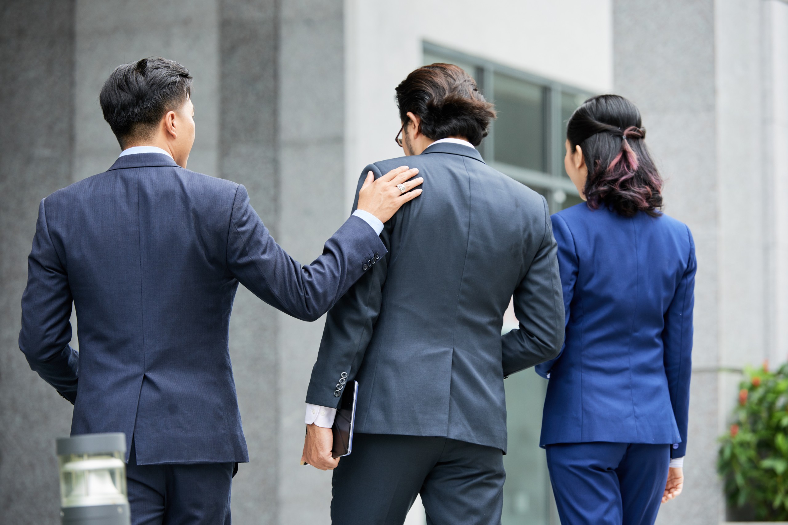 board of directors charter - group-elegant-businesspeople-walking-street